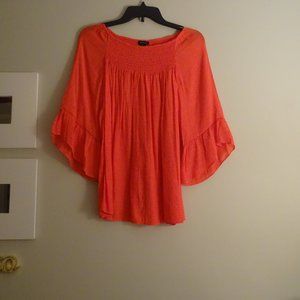 New directions bright orange top